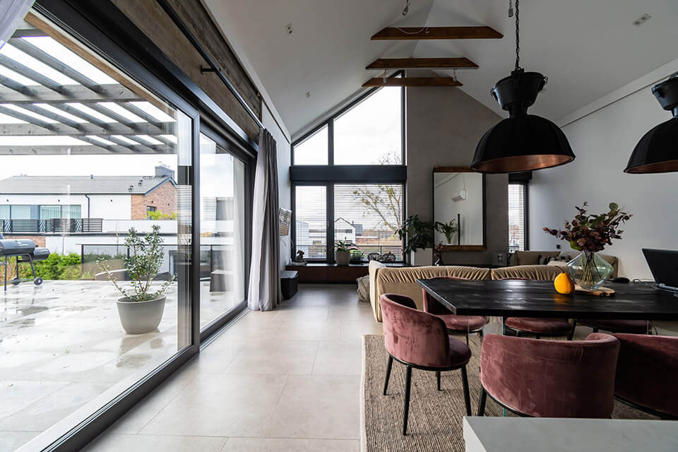 Modern barn - interior with windows all over the wall.