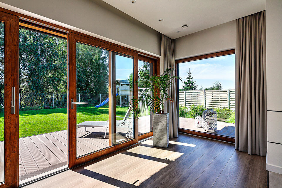 Lift and slide doors in wood-like veneer.