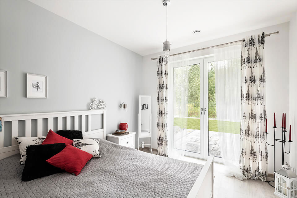 Balcony windows in the bedroom.