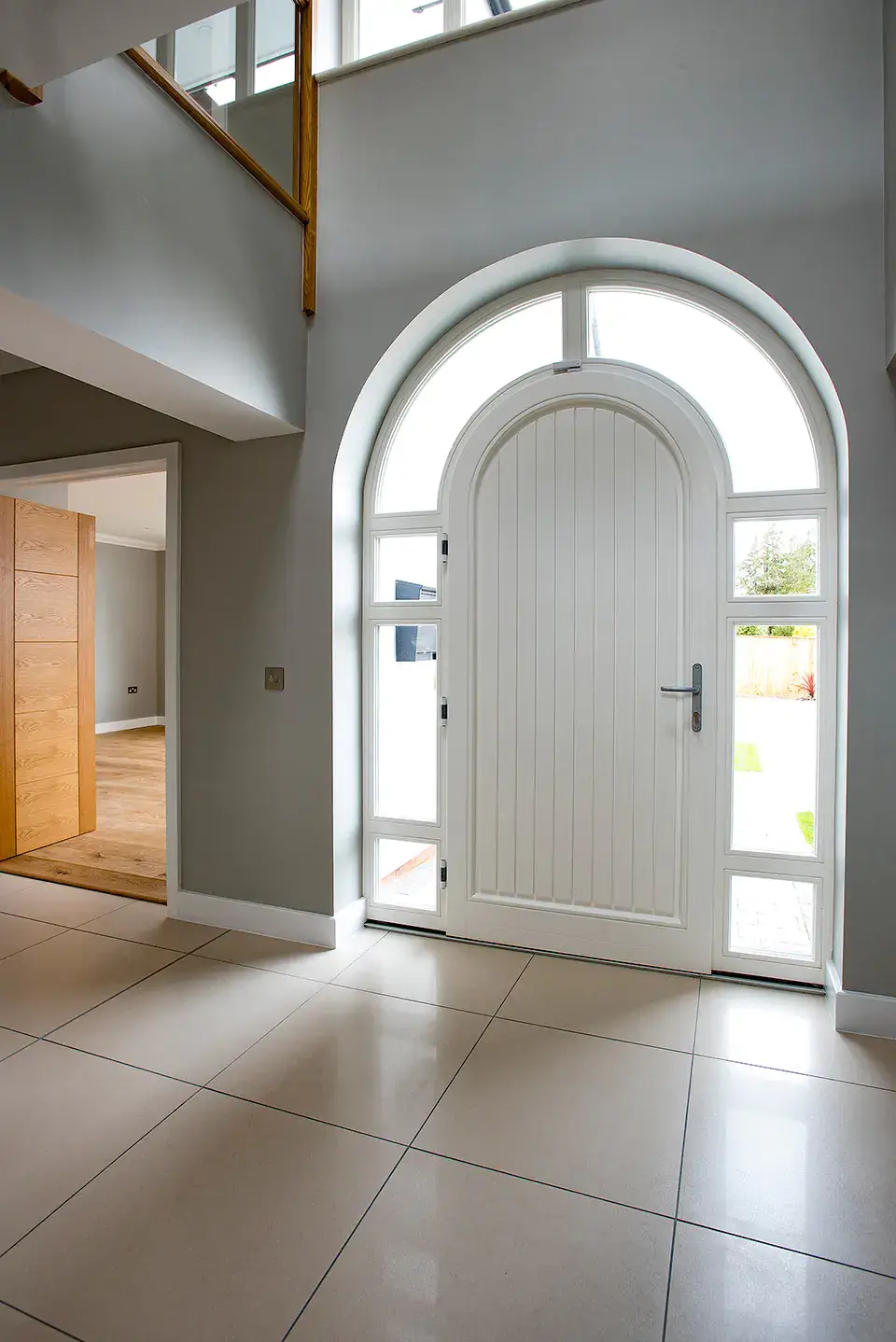 Arched white wooden door