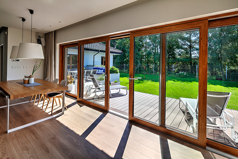 Large windows in wood-like veneer.